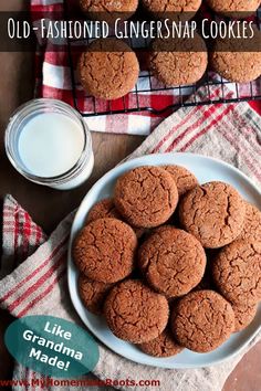 old - fashioned ginger snap cookies on a plate with a glass of milk next to it