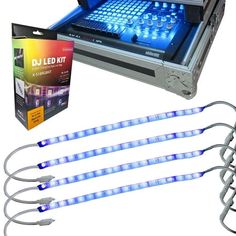 four blue lights are attached to the back of an electronic device with its box and instructions