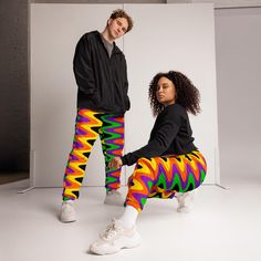 The unisex track pants are your new go-to piece for working out or styling a streetwear outfit. The water-resistant, lightweight fabric and mesh lining provide comfort, while elastic ankle cuffs will make it easy for you to show off your kicks. Style it with a windbreaker for a complete look and feel. * 100% polyester * Fabric weight: 2.21 oz/yd² (75 g/m²) * Lightweight, water-resistant fabric * Fully lined, mesh lining  * Relaxed fit * Elastic waistband and ankle cuffs * Drawcord * Zip pockets * Sits at hip * Blank product sourced from China This product is made especially for you as soon as you place an order, which is why it takes us a bit longer to deliver it to you. Making products on demand instead of in bulk helps reduce overproduction, so thank you for making thoughtful purchasing Hip Hop Sweatpants For Jogging, Multicolor Sweatpants For Streetwear In Spring, Hip Hop Joggers With Elastic Waistband For Jogging, Urban Moisture-wicking Joggers For Streetwear, Moisture-wicking Stretch Pants For Streetwear, Stretch Moisture-wicking Pants For Streetwear, Relaxed Fit Multicolor Sweatpants For Streetwear, Multicolor Relaxed Fit Sweatpants For Streetwear, Trendy Multicolor Sweatpants For Streetwear