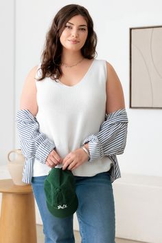 Experience style and comfort with our Plus Size Sleeveless V-Neck Sweater Top. Made from high-quality materials, this top is designed to flatter your figure while keeping you cool and comfortable. Perfect for any occasion, this top is a must-have for any plus size wardrobe. Get yours today! 🖤 Complete the look: Pair with denim shorts and flat sandals for a chic summer outfit. Add a long cardigan and snickers for a stylish, layered look. Dress it up with heeled mules and midi denim skirt for a more polished ensemble. 🖤 Features: women plus spring-fall sweater Tank, knit, three solid colors, sleeveless, relax fit, deep v-neckline, comfy tank is perfect for any occasion! Plus Size Wardrobe, Midi Denim Skirt, Denim Skirt Fashion, Chic Summer Outfits, Midi Denim, Plus Size Romper, Fall Winter Dresses, Winter Outerwear, Fall Sweater