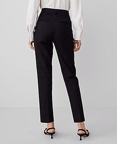 Elevate your wardrobe with the Ann Taylor High Rise Eva Ankle Pant, a piece that redefines elegance with its sleek silhouette. These pants are designed to flatter with a high rise that sits just below the natural waist and a slim leg that gracefully crops at the ankle. Perfect for both office and casual wear, these versatile pants are a must-have in every fashion-forward woman's collection.

- **Size**: 4 Regular
- **Color**: Black
- **Material**: 92% Cotton, 8% Spandex
- **Gender**: Female
- ** Slim Dress Pants, Lean Legs, Ankle Dress Pants, Knitted Suit, Tall Pants, Free Dresses, Black Dress Pants, Slim Leg, Ankle Pants