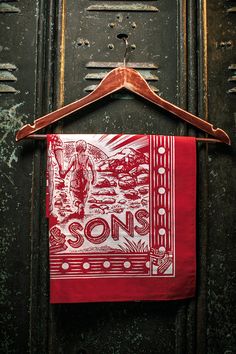 Original &SONS 100% cotton bandana featuring our unique woodcut print of a father and his two sons. Each bandana is screen printed so everyone is individual and unique. The perfect complement to the &SONS clothing range, our woodcut bandana can be worn tied loosely around the neck, as a headband – or as a face covering. A unique design and a perfect fabric - it looks great with my leather toggle. Complete your outfit A statement of style through history Origins The bandana has always been a stat Son Clothes, Raw Denim Jeans, Woodcut Print, Baker Boy Hat, Selvedge Denim Jeans, Two Sons, Orange Scarf, Woodcuts Prints, Cotton Bandanas