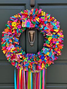 a colorful wreath is hanging on the front door