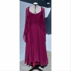 Vintage Karl Lagerfeld Silk Chiffon Gown Maxi Dress Burgundy Size: 44 Lining slip Chest: 36.5/37" Outer shell: 38" Length: 54" 100% silk Back zipper and button closures Slip liner Condition: Great. There is one button missing on the right arm sleeve. See close up photo. Fitted Silk Chiffon Sheer Evening Dress, Fitted Sheer Silk Chiffon Dress, Fitted Sheer Silk Chiffon Evening Dress, Formal Fitted Silk Chiffon Dress, Sheer Fitted Chiffon Dress In Georgette, Fitted Sheer Georgette Chiffon Dress, Fitted Silk Chiffon Dress For Wedding, Flowy Silk Chiffon Dress, Sheer Silk Chiffon Dress For Formal Occasions