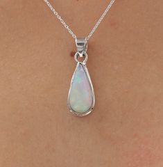 Ethiopian Opal Pendant - 925 Sterling Silver Necklace - October Birthstone - Pear Gemstone Necklace - Halloween Jewellery - Birthday Gift    Gemstone Name - Ethiopian Opal Stone Quality - AAA. Weight -  3.33 g  Length  - 3.1 cm Width -  1.1 cm Stone Shape - as Shown In The Picture. The Height of the pendant including the loop is 3.1 cm 18 inch Chain - The total length of the chain is 18 inch including a 2-inch adjustable chain. So you can adjust the chain from 16 inches to 18 inches. You adjust Sterling Silver Teardrop Birthday Necklaces, Sterling Silver Teardrop Necklace For Birthday, Sterling Silver Teardrop Necklace For Birthdays, Sterling Silver Necklace With Bail As A Gift, Teardrop Gemstone Jewelry For Birthday, Silver Oval Necklace For Birthday, Hallmarked Pear-shaped Sterling Silver Jewelry, Sterling Silver Pendant For Birthday, Sterling Silver Teardrop Jewelry With Bail