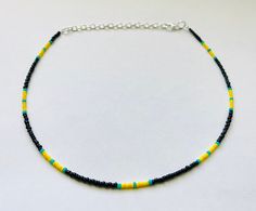 This super cool seed bead necklace is made with black, yellow, and turquoise seed beads.  It comes in 4 different lengths (14, 16, 18, and 20 inches) and every necklace also comes with adjustable extender chain.  This necklace has a beautiful contrast and makes an awesome and easy jewelry gift! Summer Choker, Black Beaded Necklace, Mens Beaded Necklaces, Easy Jewelry, Yellow Necklace, Black Bead Necklace, Summer Necklace, Necklace Beaded, Grad Gifts