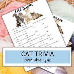 the cat trivia printable quiz is on top of yarn