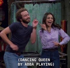 a man and woman standing next to each other in front of a mirror with the caption dancing queen by aba playing