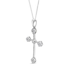 Wear a beautiful reminder of your faith and beliefs when you choose this vintage-inspired diamond clover-ends cross pendant in white gold. Fashioned in cool 10K white gold A bezel-set diamond sparkles at the center. Quartets of diamonds in clover shapes punctuate the milgrain-detailed edges. Captivating with 1/5 ct. t.w. of diamonds This pendant suspends along an 18.0-inch box chain that secures with a spring-ring clasp. White Gold Crucifix Diamond Necklace For Anniversary, Anniversary White Gold Diamond Cross Necklace, Anniversary White Gold Cross Necklace With Diamond Accents, White Gold Cross Necklace With Diamond Accents For Anniversary, Fine Jewelry White Gold Cross Necklace For Anniversary, Classic White Gold Cross Necklace For Anniversary, Bezel Set Diamond, Box Chain, Bezel Setting