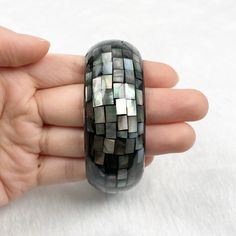 One piece of Black Mother Of Pearl Mosaic Bangle. ･ ｡ﾟ☆: *.☽ .* :☆ﾟ. Handmade Bangle Materials: Black Mother Of Pearl, Resin Chain style: Mosaic Adjustable length: No Can be personalized: Yes Made to Order (Timeframe depends on quantity) ･ ｡ﾟ☆: *.☽ .* :☆ﾟ. Shop Link: www.etsy.com/shop/taichungjewelleryH Unique Black Bangle Cuff Bracelet, Unique Black Bangle Jewelry, Elegant Handmade Black Bangle, Modern Black Bangle, Modern Black Round Bangle, Handmade Black Round Bangle, Unique Black Bangle As Gift, Unique Black Bangle For Gift, Black Handmade Cuff Bracelet For Formal Occasions