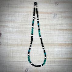 This hand-beaded choker is an excellent addition to any western outfit. Perfect for rodeos and country concerts. It is made with elastic and includes an extension chain to be able to fit most necks comfortably. I can adjust the length if needed as well.  *This necklace is handmade with care. Some materials are more fragile than others. I make every effort to ensure durability, but please make sure to treat your jewelry with special care (like taking it off before showers).* *Please be aware that each product is handmade and unique. This means that each product may vary a little bit from the pictures.* Black Southwestern Necklaces For Festivals, Black Southwestern Necklace For Festival, Adjustable Black Beaded Turquoise Necklace, Bohemian Adjustable Black Turquoise Necklace, Southwestern Style Black Necklace For Festivals, Southwestern Style Black Necklace For Festival, Southwestern Black Beaded Necklaces For Festivals, Adjustable Southwestern Beaded Necklace With Black Beads, Southwestern Black Beaded Necklace For Festivals