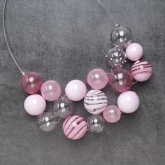 "This Light pink statement necklace is made of glass in the lampwork technique, each bead is hand blown and unique. This Bright pink chunky necklace is lightweight, stylish and elegant and will become a versatile and irreplaceable addition to your everyday outfits! 💕 You will definitely look stunning in this glass bubble necklace! Dimensions: the necklace length is adjustable, 16 1/2\"-19\" inch (42-48cm). Materials: artist lampwork glass beads, metal fittings. 🎁 This big bead necklace will al Elegant Pink Glass Beaded Necklaces, Elegant Pink Glass Beaded Necklace, Pink Glass Necklace With Round Beads, Pink Glass Party Jewelry, Light Pink Necklace, Big Bead Necklace, Pink Statement Necklace, Bubble Necklace, Bold Statement Necklaces