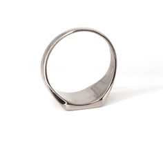 This ring is the perfect choice for men who are looking for a unique and stylish piece of jewelry. It is made of 925 silver and features a bold bar design that is sure to stand out. The silver color is perfect for making a statement and will match any outfit.    Handmade item  Material detail  Metal: Sterling Silver  Hypoallergenic and Lead, Cadmium, and Nickel Free.  Gift wrapping available  Jewelry Pieces Made in New York City USA. What is sterling silver?  Since its creation, sterling silver has been used in jewelry design by all cultures across the world. Sterling silver contains 92. 50% pure silver and is mixed with other alloys such as copper, zinc, or palladium to make it stronger and more durable overall. From a manufacturing perspective, this implies that sterling silver can be wo Silver Polished Signet Ring For Everyday, Modernist White Gold Signet Ring With Polished Finish, Classic Rectangular Signet Ring Stamped 925, Modern Hallmarked Signet Ring For Everyday, Modern Engraved Rings For Everyday Wear, Modern Silver Signet Ring With Polished Edges, Modern Silver Signet Ring With Polished Finish, Modern Formal Signet Ring Stamped 925, Modern White Gold Signet Ring Stamped 925