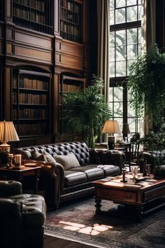 a living room filled with lots of furniture and bookshelves next to a window