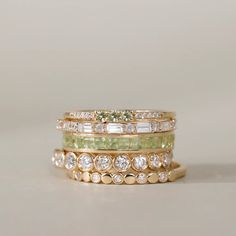 Adorn your finger with our Peridot Full Eternity Ring, a radiant celebration of August's birthstone. This exquisite piece showcases the warm allure of the green gemstone in a princess cut, offering a perfect blend of sophistication and individuality. Elevate your style with this timeless and vibrant symbol of elegance. Classic Green Multi-stone Diamond Ring, Green Multi-stone Diamond Ring, Elegant Green Diamond Eternity Band, 14k Gold Green Diamond Princess Cut Ring, Green Princess Cut Diamond Ring In 14k Gold, Princess Cut Green Diamond Ring In 14k Gold, Classic Green Stackable Diamond Ring, Classic Green Gemstone Eternity Band, Luxury Stackable Emerald Wedding Ring