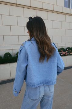 DETAILS: Our Cropped Denim Trench Jacket is a cropped light wash denim jacket with the cutest oversized fit. This collared denim jacket features a tortoise button details throughout ,adjustable belted waistline, functional pockets, and belted sleeve detail. The trench style silouette is what gives this jacket a truly unique look. This jacket is completed with a relaxed and comfortable fit. This jacket has little to no stretch and runs true to size. CONTENT & CARE: SELF: 100% Cotton. SIZE & FIT: Cropped Denim Jacket With Pockets, Trendy Light Wash Denim Jacket With Button Closure, Trendy Light Wash Denim Jacket With Buttons, Casual Cropped Jacket With Snap Buttons, Casual Cropped Denim Blue Jacket For Spring, Casual Button-up Cropped Jacket For Streetwear, Spring Streetwear Cropped Jacket With Button Closure, Casual Cropped Jacket In Denim Blue For Spring, Casual Cropped Jacket For Day Out