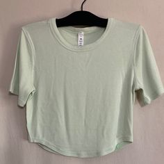 Nwot Lululemon Hold Tight Cropped T-Shirt Size 6 Color Kohlrabi Green Picture Shows A Model Wearing The Bone Color To Show The Way It Fits Color Is A Light Green See Pics For Details Ships Out Same Day Price Firm Fitted T-shirt For Yoga In Spring, Fitted Solid Color Workout T-shirt, Spring Cropped Crew Neck T-shirt For Workout, Spring Casual Yoga T-shirt, Fitted Crew Neck Top For Yoga, Fitted Scoop Neck Workout T-shirt, Spring Short Sleeve Tops With Snug Fit, Fitted Scoop Neck T-shirt For Workout, Snug Fit Short Sleeve Tops For Spring