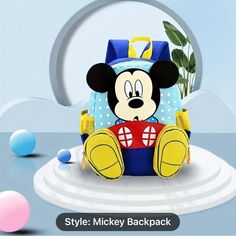 Small Mickey Mouse Backpack Front Body With 3-Zipper Pockets Blue Cartoon Bags For Back To School, Blue Portable Backpack For Back To School, Blue Cartoon Backpack Bag, Blue Cartoon Style Backpack Bag, Blue Cartoon Backpack, Blue Cartoon Backpack For Everyday Use, Blue Character Backpack For Disney Trips, Cute Blue Backpack With Zipper Closure, Blue Cartoon Style Backpack