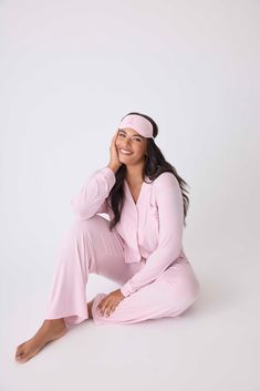 Elevate your sleepwear with purpose in our Women's classic pajama set in pink modal, created in partnership with the Susan G. Komen Foundation. This set boasts ivory piping, a button-front collared top, and straight-leg tie-waist pant, complemented by an embroidered eye mask with 'LOVE'. For 2024-2025, P.J. Salvage proudly pledges a $50,000 donation to Susan G. Komen. Soft Pink Sleepwear For Relaxation, Elegant Pink Sleepwear For Loungewear, Feminine Solid Color Sleepwear For Loungewear, Feminine Long Sleeve Sleepwear For Loungewear, Feminine Long Sleeve Sleepwear For Relaxation, Feminine Relaxed Fit Loungewear Sets, Susan G Komen, Classic Pajamas, Tie Waist Pants