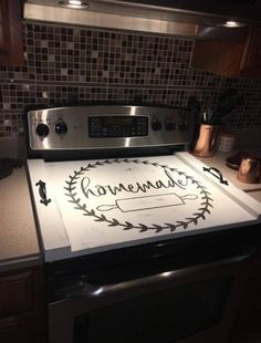 a stove top with the words homemade written on it in front of a microwave oven