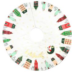 a white christmas tree skirt with houses and trees on it