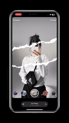 an iphone with the image of a woman in white shirt and tie