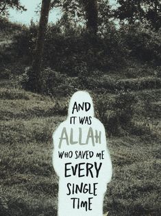 a sign that says and it was allah who saved me every single time in front of some trees