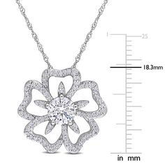 A floral for all seasons, this moissanite flower necklace refreshes your look, crafted in sterling silver. A gaze-grabbing single round lab-created moissanite centers an open moissanite-paved flower blooming with vibrant details and not so subtle dazzle. Naturally found in meteorites, lab-created moissanite gemstones are ultra-resilient with a disco-ball light effect that provides unparalleled sparkle. The total diamond equivalent weight is approximately 1 1/10 carats. | Moissanite Flower Neckla Silver Solitaire Necklace With Flower Pendant, Diamond White Jewelry With Flower Shape And Diamond Accents, Flower-shaped Cubic Zirconia Necklace With Diamond Accents, Cubic Zirconia Flower Shaped Necklace With Diamond Accents, Flower Shaped Cubic Zirconia Necklaces With Diamond Accents, Flower Shaped Necklace With Diamond Accents And Cubic Zirconia, Diamond White Flower Pendant Necklace With Prong Setting, Flower Shaped Brilliant Cut Cubic Zirconia Necklaces, Brilliant Cut Cubic Zirconia Flower Necklace