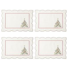 four placemats with christmas trees on the front and bottom, one is white