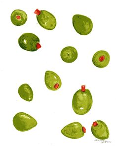 some green olives with red spots on them are in the middle of a white background