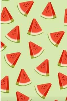 watermelon slices are arranged on a green background