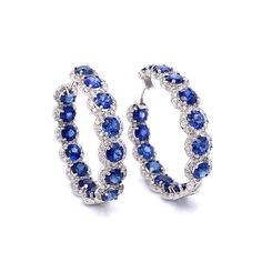 Stylish hoop 18k white gold earrings with blue sapphires and diamonds. Sapphires are round cut Ceylon blue gems 13.58 ct total. Accented by white round diamonds 3.98 ct in total. Diamonds are white and natural and in G-H Color Clarity VS. 18k white gold Length: 3 cm diameter Weight: 15 g [shortcode] [video] [/video] [/shortcode] Diamond Sapphire Earrings, Sapphire Hoop Earrings, Sapphire Jewellery, Blue Sapphire Jewelry, Diamond Tops, White Gold Hoop Earrings, Platinum Bracelet, White Gold Hoops, Platinum Earrings