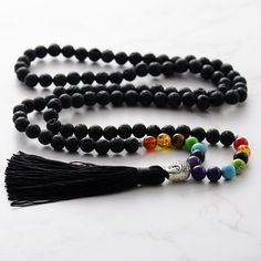 "Chakra 7 Black Lava Stone Mala 108 Necklace | Hand Knotted Mala Beads Necklace | Handmade Jewellery for Woman  You will receive: ⭐️ 1 x Handmade Chakra 7 Black Lava Stone Mala 108 Necklace  ⭐️ 100% Money Back Guarantee ⭐️ Free Shipping: US & Worldwide -  8mm Chakra 7 Black Lava Stone  -  Necklace length: 39-41inch -  Necklace weight: 120g - Tassel Length: 4.7inch Chakras are thought to provide subtle energy that helps your organs, mind, and intellect work at their best level. Chakras and spirit Black Bohemian Beaded Bracelets For Meditation, Handmade Black Mala As Gift, Black Hand-strung Beads For Jewelry Making, Black Beaded Bracelet With 108 Beads For Meditation, Handmade Black Beaded Necklaces For Healing, Handmade Black Mala For Meditation, Black Handmade Beaded Necklaces For Healing, Black Handmade Beaded Necklace For Healing, Adjustable Black Beaded Necklaces With 8mm Beads