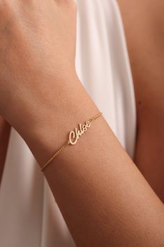 ✨ Made of 925 Sterling Silver  and Solid Gold Materials✨ 💕 Dainty Name bracelets are really trendy. An elegant piece to have in your collection. 🎄 Gold Name Bracelet will be a great gift for your loved ones. 🌙Perfect gift for Mothers Day Personalized 14k Gold Name Bracelet is the most favorite choice of recent times. Named Gold Bracelet is carefully handcrafted by our very experienced craftsmen. Name Bracelet is an elegant jewel. Name Signature Bracelet can really make your loved ones emotional. You can choose it as a Mothers Day Gift for your mom. Made of 100% 925 Sterling Silver. We can prepare 8k - 14k - 18k Solid Gold or Silver according to your preference. Personalized 14k Gold Box Chain Name Bracelet,  Custom Name Bracelet, Valentine Day Gifts for Her, Handmade Gift for Mom, Mothe Meaningful Jewelry With Adjustable Chain As A Gift, Dainty Gold-plated Name Bracelet With Jubilee Design, Gold Nameplate Jewelry With Box Chain, Gold Plated Dainty Name Bracelet With Jubilee Design, Elegant Everyday Charm Bracelet For Valentine's Day, Rose Gold Bracelet Jewelry As A Gift, Gold Dainty Jewelry Gift, Gold Dainty Jewelry For Gifts, Rose Gold Jewelry With Hallmark For Birthday Gift