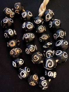 Antique Vintage Black & White Zen Venetian African Trade Beads ~ *Handcrafted in Venice in the 19th-Early 20th Century *16" strand *28 Round Zen Beads 15mm *This strand are not intended to be a ready-to-wear necklace; best for restringing on more durable thread *In very good, antique used condition from traveling 3 continents & aged over 100 years old with some signs of use & wear normal for these types of beads-small chips, corrosion, etc adding to their wonderful patina African trade beads ori Hand-strung Black Jewelry For Festivals, Black Beaded Necklace With Large Beads For Festivals, Black Beaded Necklaces With Large Beads For Festivals, Handmade Black Necklace For Festivals, Handmade Black Necklaces For Festivals, Black Hand-strung Jewelry For Festivals, Traditional Black Wooden Beaded Bracelets, Traditional Black Beaded Necklace, Black Round Beaded Bracelets For Festivals