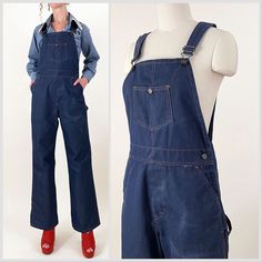 70s indigo dark wash wide leg bib overalls. Stiff denim fabric, may be a blend, with orange contrast stitching, embossed buttons and carpenter pockets. Seem almost unworn except for a fade on the leg - please see photos. In overall great vintage condition.   All measurements are taken with the garment laying flat and doubled for the bust, waist, and hips.  Waist: 32" Hips: 40" Rise to Waist: 12.5" (taken at top of waistband) Rise to Shoulder: 31" at longest strap length / 28" at shortest strap length Upper Thigh: 12.5"across Inseam: 29.5" Length (shoulder to hem): 59" at longest strap length / 56" at shortest strap length Label: Missing Size on Tag: N/A Approx. Fit: 29-31 waist depending on desired fit  Some garments have been adjusted in photos to fit the form. Please reference measuremen Medium Wash Bib Front Jeans For Work, Dark Wash Wide Leg Overalls With Pockets, Wide Leg Dark Wash Overalls With Pockets, Utility Cotton Denim Jumpsuit With Belt Loops, Utility Style Cotton Denim Jumpsuit With Belt Loops, Denim Bib Front Jeans For Workwear, Dark Wash Utility Denim Jumpsuit With Bib Front, Utility Style Dark Wash Denim Jumpsuit With Bib Front, Workwear Bib Front Jeans With Pockets