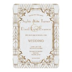 a white and gold wedding card with an art deco design on the front, which reads please