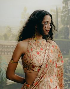 Exude elegance in a biscuit printed sari in dupion silk, paired with a matching printed dupion silk, blouse featuring embroidered neck details. This ensemble combines subtle sophistication with intricate craftsmanship. Silk Choli With Printed Motifs, Festive Silk Choli With Printed Motifs, Diwali Silk Choli With Printed Motifs, Silk Pre-draped Saree With Printed Motifs, Art Silk Pre-draped Saree With Printed Motifs For Wedding, Elegant Blouse With Printed Motifs For Designer Wear, Elegant Choli With Printed Motifs For Festive Occasions, Elegant Choli With Printed Motifs For Festive Season, Elegant Festive Choli With Printed Motifs