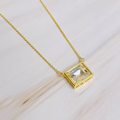 Elevate your everyday look with our Sweet Square Pendant Necklace. The sparkly pendant and dainty chain add a touch of chic elegance to any outfit. Wear it alone for a simple and sophisticated look, or layer it with other pieces for a stylish and versatile statement. Chain length: 16 inches with 2 inches extension 18k gold plated brass, glass jewel Lead and nickel free Made in China Lifetime Candles, Square Pendant Necklace, Hair Setting, Dainty Chain, Square Pendant, Brass Glass, Diamond Pendant Necklace, Sympathy Gifts, Scrunchie Hairstyles