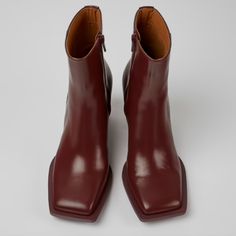 New Without Box Burgundy Leather Ankle Boots Size Usl 7 - Eu 37 Burgundy Leather Women's Ankle Boots With Ortholite Recycled Footbeds And Rubber Outsoles Upper Calfskin (Leather Working Group Certified) Color Burgundy Outsole/Features 80% Rubber / 20% Recycled Rubber Side Zip Insole Ortholite For Cushioning Height 7,3 Cm Lining 55% Textile (45% Recycled Polyester - 35% Recycled Cotton - 20% Viscose) 18% Leather / 17% Nubuck / 10% Recycled Polyester Burgundy Leather Square Toe Boots, Burgundy Leather Heeled Boots With Pointed Toe, Burgundy Leather Pointed Toe Heeled Boots, Burgundy Leather Ankle Boot Heels, Burgundy Ankle-high Leather Heels, Leather Heels With Red Sole And Square Toe, Formal Boots With Red Sole And Square Toe, Camper Shoes, Women's Ankle Boots