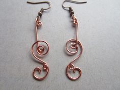 handmade with copper wire Double loop broken note spiral earrings is a gorgeous piece of art the design and idea is similar to my broken note design just with a little more spice Copper and silver will tarnish over time avoid/ limit contact with anything wet or moist like lotions, soaps and never wear it where it can come in contact with water to prolong the shine if tarnish just simply polish the piece with a jewelry polishing cloth I just started this shop so I'm still working out some Kinks s Music Note Earrings, Swirl Earrings, Spiral Earrings, Notes Design, Jewelry Boho, Still Working, Note Design, Copper Earrings, Copper Wire