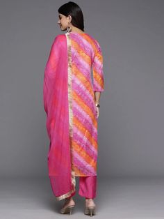 Grab this beautiful 3-piece set. The set comes with foil print, bandhani & zari embroidery kurta has round neck, 3/4th sleeves & calf length teamed with solid trouser pant with elasticated waistband and a slip-on closure and a silk chiffon dupatta with lace detailing. Color - Pink Kurta Fabric-Cotton Blend Bottom Fabric-Cotton Blend Dupatta Fabric - Silk Chiffon Neck-Round Neck Sleeves-3/4th Sleeves Work - Foil Print, Bandhani & Zari Embroidery Washing Instructions-Hand Wash DISCLAIMER - The color of the product may be differ due to screen settings of device. A misprint here and a color drop slip there is the beauty of printing which is not treated as a defect. Chanderi Bandhani Print Palazzo Set With Straight Kurta, Bandhani Print Chanderi Palazzo Set With Straight Kurta, Festive Multicolor Unstitched Kurta, Multicolor Chanderi Sets With Straight Kurta, Multicolor Unstitched Suit With Sheer Dupatta, Multicolor Art Silk Kurta For Diwali, Multicolor Salwar Kameez With Sheer Dupatta, Multicolor Chanderi Salwar Kameez With Straight Kurta, Diwali Bandhani Print Semi-stitched Anarkali Set