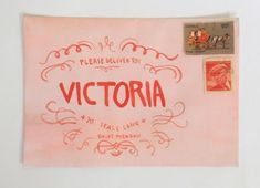 a piece of pink paper with the words victoria on it and an image of a woman