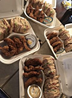 several trays filled with different types of food