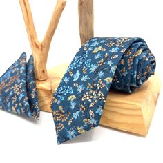 "Flower Navy Blue Neck Ties / Wedding Neck Ties / Mens Necktie / Groomsmen Necktie / Pocket Square Set / Neck Tie For Men/ Neck Tie This navy blue tie has a unique style with floral patterns of various colors on it. It is a unique handmade tie that you can only find on this page. You can either gift this hand-made Flower Navy Neck Ties or you can use it yourself to feel different on your special days. Please include your size option for the bow tie in your order notes. Otherwise, Adult size will Blue Ties For Father's Day, Blue Groom Suit Accessories With Pocket Square, Blue Suit And Tie Accessories For Groom, Blue Ties And Pocket Square For Groom, Blue Ties With Pocket Square For Wedding, Blue Tie With Pocket Square For Groom, Dapper Blue Ties For Groom, Dapper Ties For Groom On Father's Day, Groom Ties For Father's Day