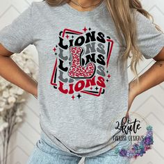 Pick yourself up one of these fun and spirit-filled Lions shirts. This shirt is sure to impress your friends and show your true Lions spirit. .  It's a soft shirt in an ash gray color with a midweight feel. This shirt is made of 95% polyester and  5% spandex. It's nice and soft with great stretch.  Some shirts may be 100% polyester depending on availability. To get the best wear from your shirt make sure to  1. Wash in cold water 2. Tumble dry low 3. Do not iron on design area 4. Do not use fabric softener This shirt is made by an ink print process. This specific shirt design is made to be a soft, vintaged look. Minor fading may occur after the first wash to enhance the vintage look School Spirit T-shirt For Game Day, Relaxed Fit, School Spirit T-shirt Relaxed Fit For Game Day, Relaxed Fit T-shirt For Game Day With School Spirit, Game Day School Spirit T-shirt With Heat Transfer Vinyl, Casual Red T-shirt For Cheerleading, Casual Game Day T-shirt With Sublimation Team Name, Casual Tops With Sublimation Print For Football Season, Casual Football Season Sublimation Design, Casual Sublimation Design With Letter Print For Game Day