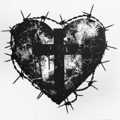 a black and white photo of a heart with a cross on it