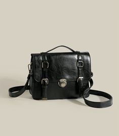 Classic vintage inspired satchel bag with a push-buckle and magnetic buckle strap closure. Carry it in your hand or wear it as a crossbody. Crafted from PU leather. Main compartment has a zip. Big enough to fit an iPad. 31cm width x 23cm height x 8cm thickness12.2" width x 9.05" height x 3.15" thickness Shoe Gifts, Satchel Bag, Sweater Blouse, Cardigan Jacket, Classic Vintage, Satchel Bags, Pu Leather, Vintage Inspired, Bag Accessories