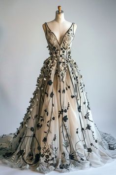 a dress with flowers on it is displayed