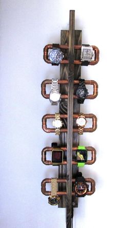 a wall mounted wine rack with watches on it